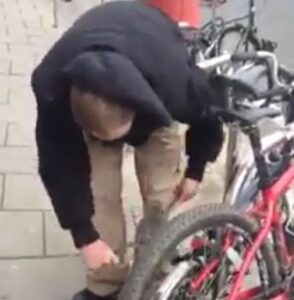 Bristol bike thief (source Facebook video still).JPG