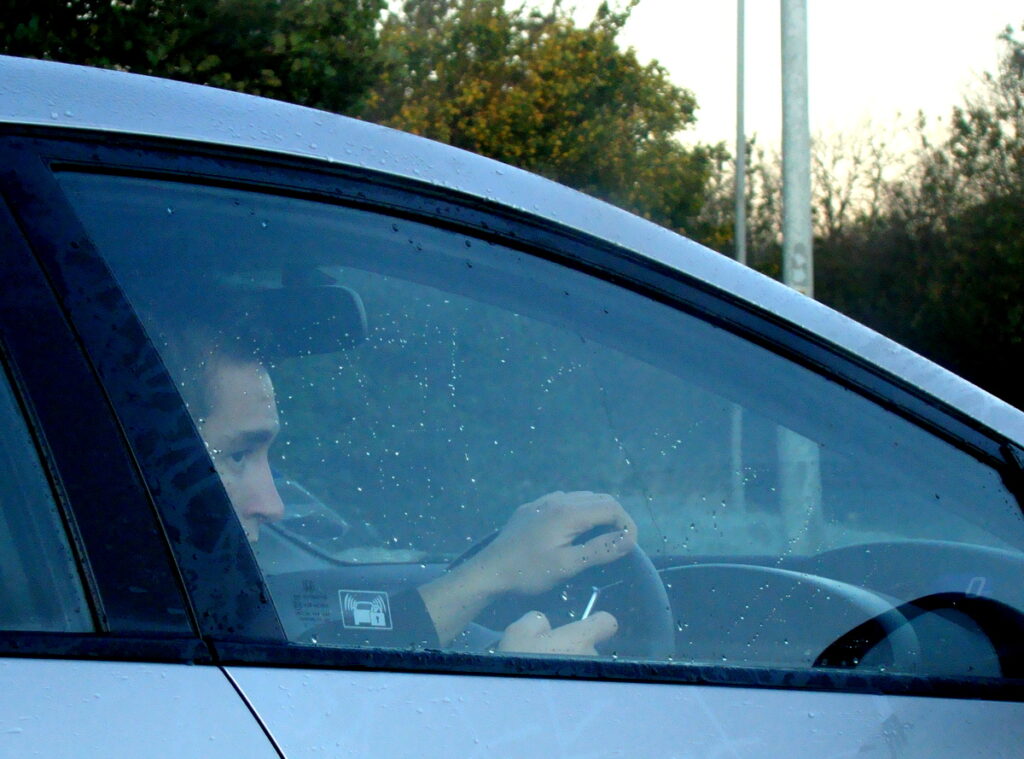 Driver using mobile (CC licensed image by lukys1:Flickr)