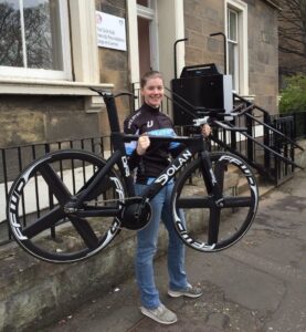 Katie Ford and the bike she will be using for her record attempt (Edinburgh Childrens Hospital via Twitter).jpg