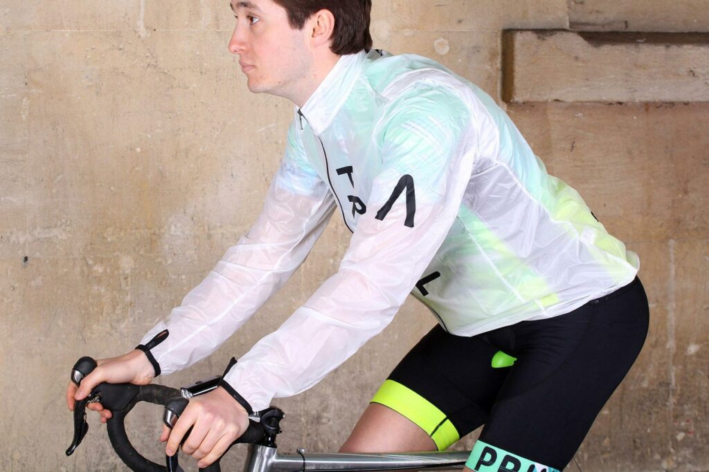Primal Onyx Mens Clear Rain Jacket – riding.jpg