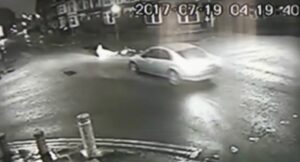 Car reverses away from cyclist (via BBC).jpg