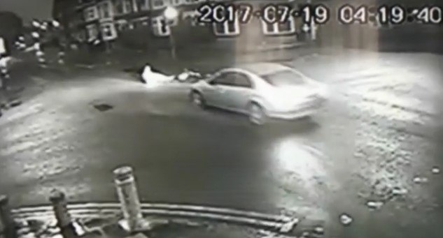 Car reverses away from cyclist (via BBC).jpg