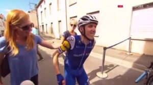 Dan Martin getting off his bike (via YouTube).jpg