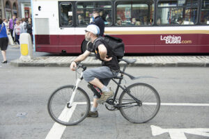 Cyclist in Edinburgh (licensed CC BY-2.0 by Mark Morgan on Flickr).jpg