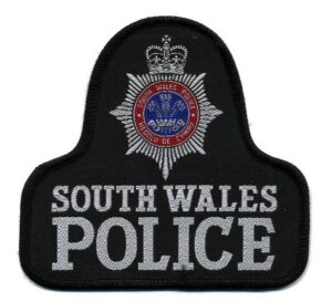 South Wales Police badge (CC licensed by Dave Conner via Flickr).jpg