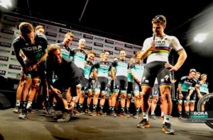 Ralph Denk shows off his Peter Sagan tattoo (via Bora-Hansgrohe).PNG