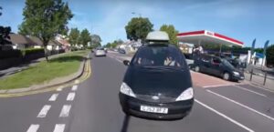 Car turning into cyclist’s path (YouTube).jpg