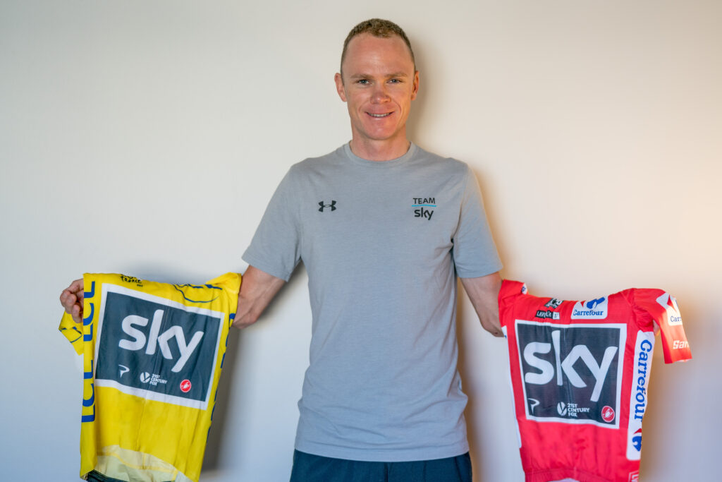 Chris Froome with Tour de France and Vuelta winner’s jerseys.jpg