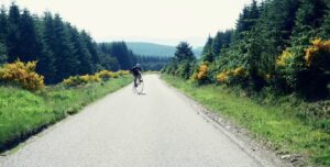 Mark Beaumont on a penny farthing (via Vimeo).jpg