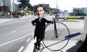 Jacob Rees-Mogg and Penny farthing (original photo licensed CC BY-SA 2.0 on Flickr by Bob Walker).jpg