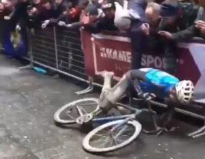 Wout van Aert cramps up at the 2018 Strade Bianche.JPG
