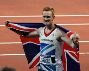 Greg Rutherford London 2012 (licensed CC BY SA 2.0 by Tab69 on Flickr).jpg
