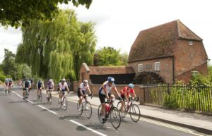 Prudential RideLondon-Surrey 100 – riders passing a mill.jpg