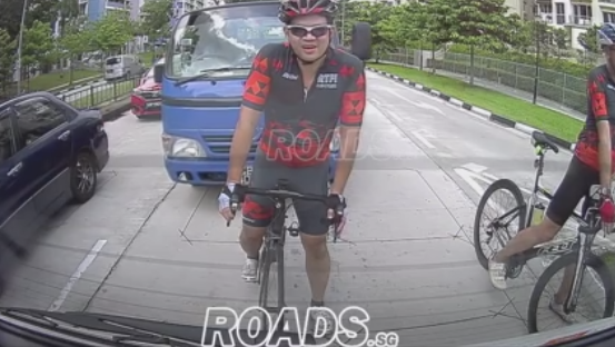 Singapore cyclist and lorry (video still via ROADS.sg on Facebook).PNG