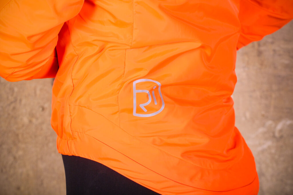 Rivelo Newington Reversible Jacket orange – reflective logo.jpg