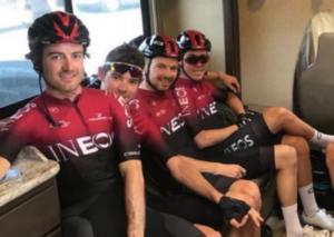Luke Rowe (second left) making hand gesture.PNG