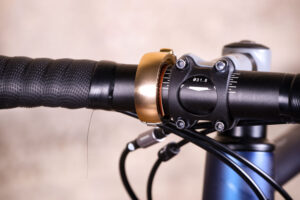 Knog Oi Luxe Bell Brass S - on bike 2.jpg