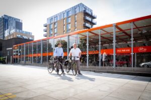 Will Norman and Cllr Clyde Loakes at a cycle parking hub in Walthamstow (TfL)