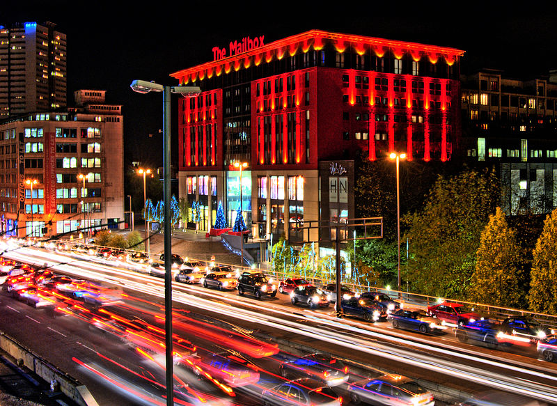 Birmingham Mailbox and traffic (licensed CC BY-SA 2.0 by Bs)u10e01 on Wikimedia Commons)