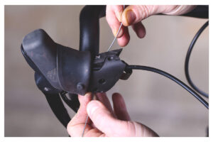Threading new cable through lever.jpg