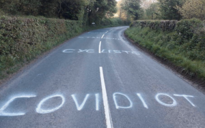 coronavirus covidiot paint on road.PNG