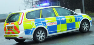 Police car flashing lights (CC licensed by Lee Haywood)