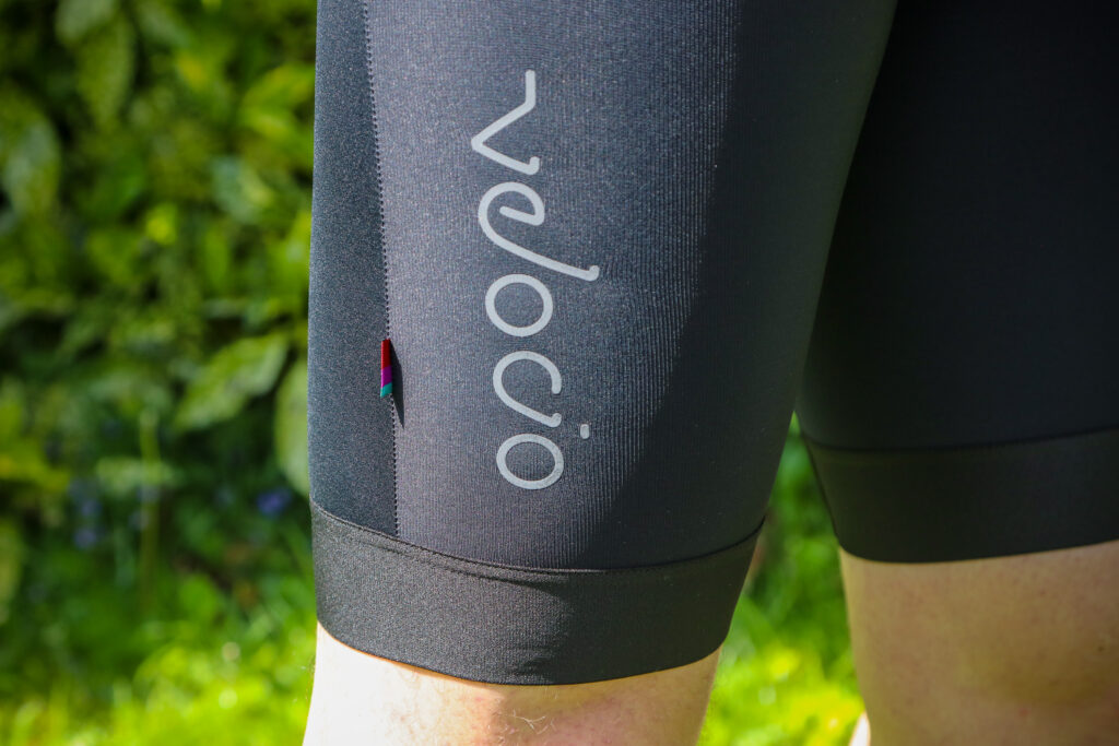 2020 Velocio Men’s Concept Bib Short – logo.jpg