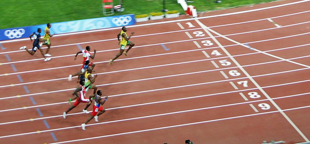 Usain_Bolt_winning-cropped – licensed CC BY 2.0 by PhotoBobil