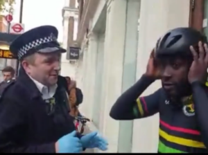 Metropolitan Police officer searches Mani Arthur (via Instagram).PNG
