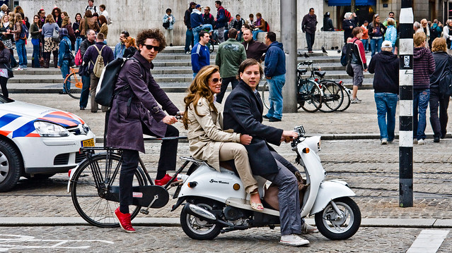 Moped riders and cyclist in Amsterdam