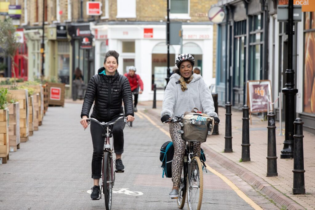Cycle Buddies, new rider Trish (grey jacket) and experienced rider Jo (black jacket) – credit Tony French+London Cycling Campaign