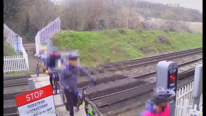 Cyclists crossing railway