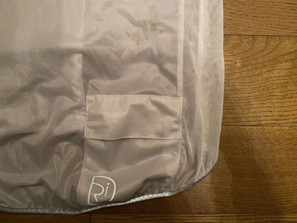 2021 Rivelo Lanterne Women’s Jacket rear pocket, logo and stain.jpg