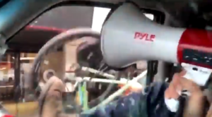 Vancouver cyclist smashes anti-mask protestor’s car window.PNG