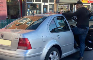 Police hunt driver who accelerated towards cyclist, knocking him from his bike, then fled scene
