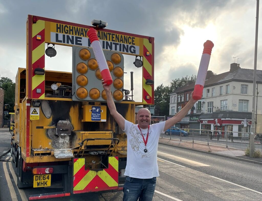 Liberal Party Councillor Steve Radford celebrates as pop-up cycle lane is ripped out