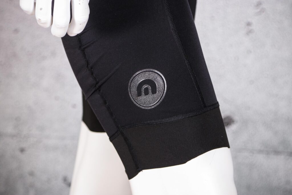 2021 Megmeister Men’s L8 Bib Short – logo.jpg