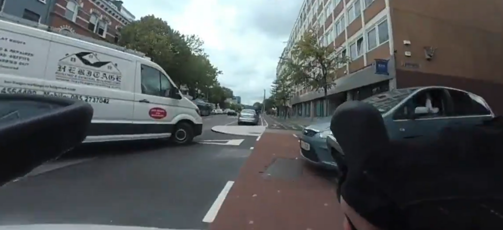Cyclist narrowly avoids double bike lane collision
