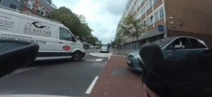 Cyclist narrowly avoids double bike lane collision