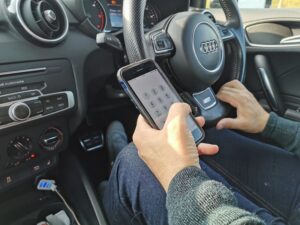 Driver using handheld mobile phone