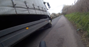 Lorry driver nearly hits cyclist while overtaking tractor