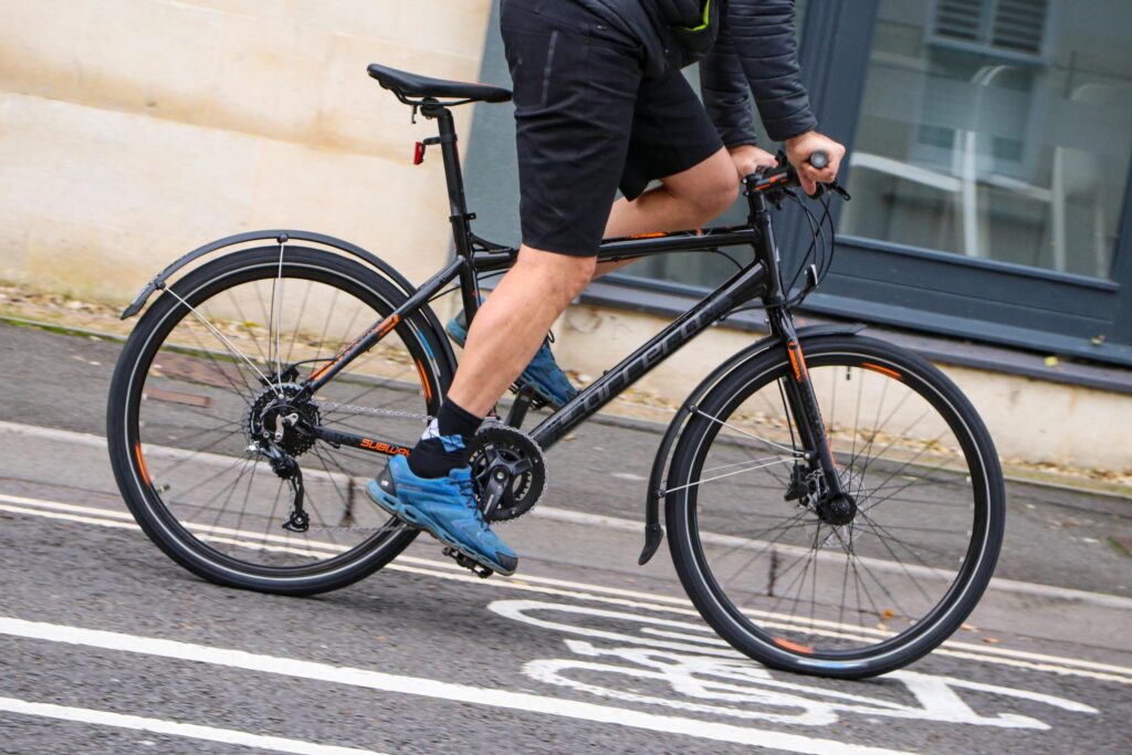 Carrera Subway All Weather Edition Men’s Hybrid Bike ridden by a man in shorts
