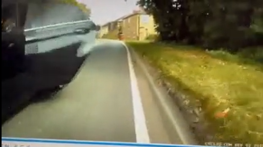Reckless moment passenger hits cyclist by opening car door as driver overtakes