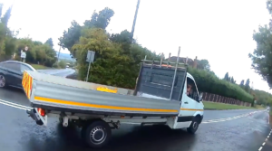 MGIF driver reverses over white lines to confront cyclist