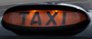 Taxi sign (licensed CC BT 2.0 by Ross Davidson on Flickr, image cropped).PNG