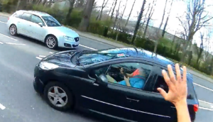 Car passenger aims “vroom” taunt at cyclist… only to be caught and passed moments later (credit – Stormont Cyclist, Twitter)