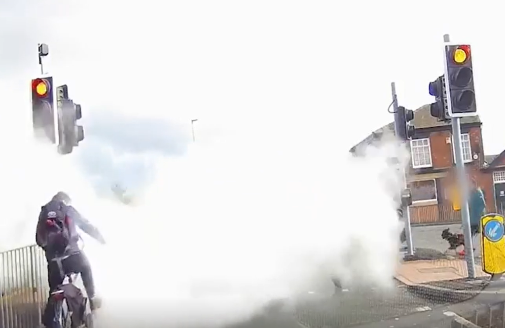Cyclist sprayed with fire extinguisher at traffic lights