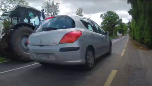 Cyclist forced off road as motorist overtakes tractor and almost causes head-on collision