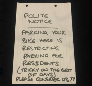 Resident leaves notice for cyclist parking bike in residential area
