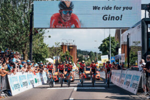 The Bahrain-Victorious riders cross the line on stage six of the 2023 Tour de Suisse in memory of Gino Mäder (Zac Williams/SWpix.com)